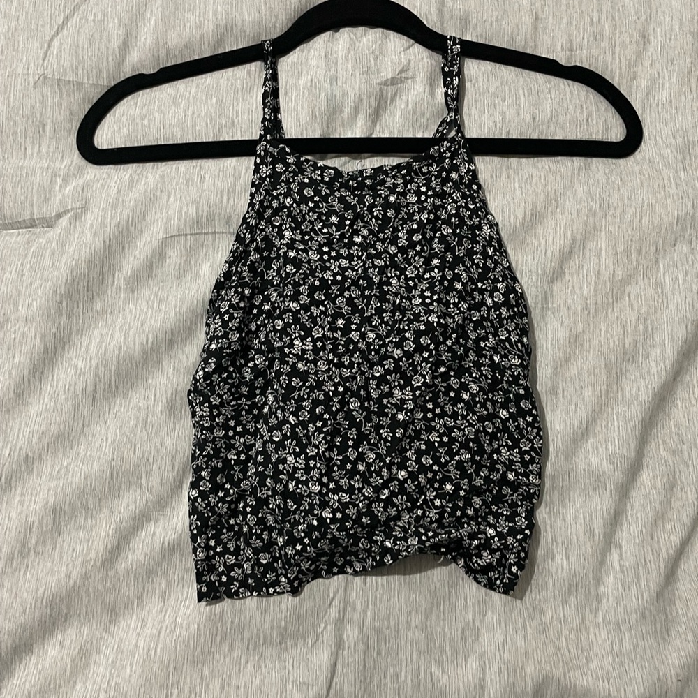 Floral print black tank top.